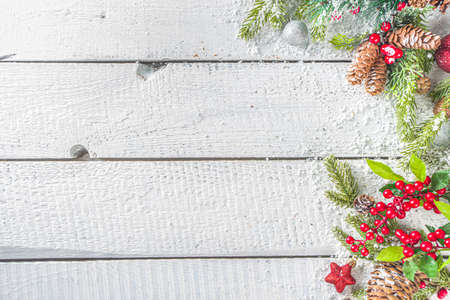 Christmas and New Year greeting card background. Xmas backdrop with fir tree branches, decoration...