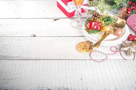 Christmas or New Year table setting. Place setting for Christmas Dinner with Xmas Holiday Decorationsの写真素材