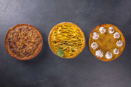 Traditional fall baking. American and Europe traditional autumn winter cakes - with pumpkin, pecan...