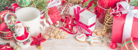 Christmas greeting cad background with decor, baubles, Xmas Gift Boxes, snow globe, hot chocolate...