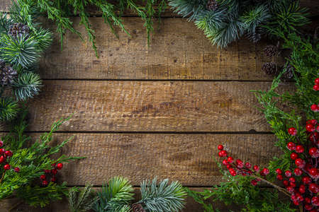 Christmas Fir Tree On Wooden Background With Snowflakes. Simple Christmas Greeting Card Background, above with copy space for textの写真素材