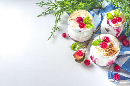 Cranberry layered Dessert breakfast in small jars for Christmas morning. Homemade baked Cranberry...