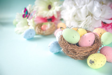 Easter greeting card background with eggs, flowers and butterflies copy space