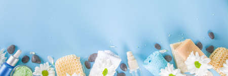 Spa element collection. Beauty and spa tools, cosmetics background with organic ingredients, skincare products and white daisy flowers copy spaceの写真素材