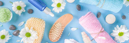 Spa element collection. Beauty and spa tools, cosmetics background with organic ingredients, skincare products and white daisy flowers copy spaceの写真素材