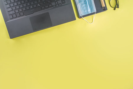 New normal Office reality, work at home concept. Office background, Laptop, notepad, office supplies...