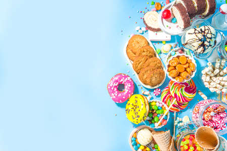 Selection of colorful sweets. Set of various candies, chocolates, donuts, cookies, lollipops, ice...