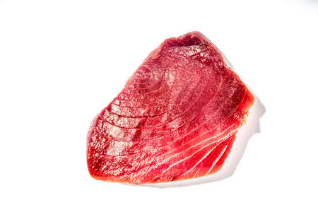 Raw red tuna fish steak isolated on white backgroundの写真素材