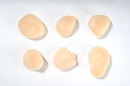 Raw seafood scallops, peeled fresh isolated on white backgroundの写真素材