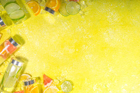 Variety of cold drinks in bottles, summer infused water bottles