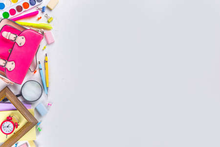 Back to school, education background. Back to School White Background with School Bag Backpack, Notebook, Pen, Pencil, Pencils, Magnifying Glass, Eraser, Paper Clip, Alarm Clock, School Suppliesの写真素材