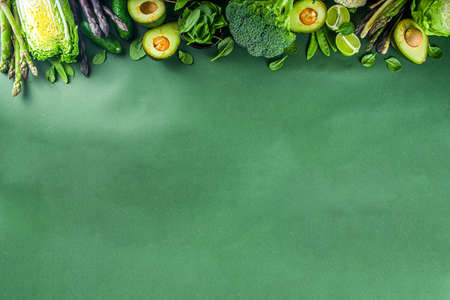 Healthy Diet Spring food background. Assortment of fresh raw organic green vegetables - broccoli,...