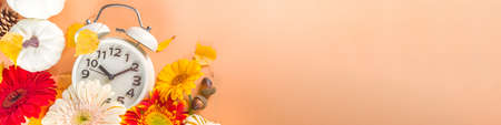 Fall Back Time. Daylight Savings End. Return To Winter Time. Autumn time change concept with Alarm...