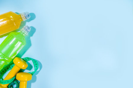 Set of isotonic sport water bottles, Various color bright energy water drinks on colorful background flat lay copy spaceの写真素材