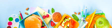Back to school, Healthy tasty kid lunch box with sandwiches, nuts, fresh fruits and vegetable...