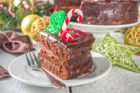 Christmas Chocolate Cake. Homemade Gingerbread Chocolate Cake with Sugar and Chocolate Decor in form...