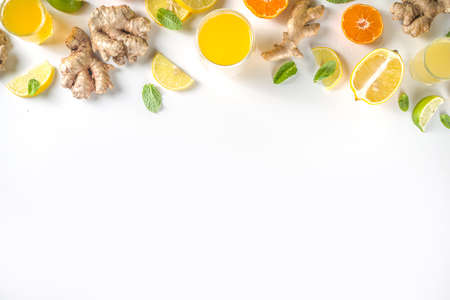 Immunity booster drink ingredients. Homemade ginger and citrus juice or cocktail, with fresh citrus...