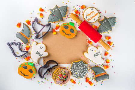 Halloween treats background with sugared Gingerbread cookies and candies, Trick or treat concept top view copy space white background copy spaceの写真素材