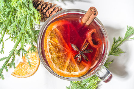 Mulled wine, traditional hot winter autumn alcohol boozy drink, with cinnamon, anise and orange, On...