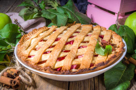 Fall traditional baking, homemade apple cake and apple pie oatmeal cinnamon cookies, halloween thanksgiving, autumn baking food, cozy baking wooden background copy spaceの写真素材