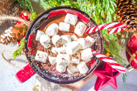 Homemade hot chocolate with mini marshmallows, hot cozy Christmas cocoa drink on wooden background...