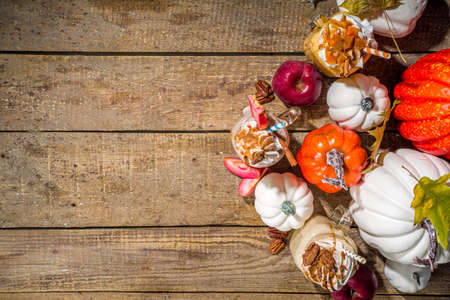 Apple pumpkin and pecan pie smoothie drinks. Traditional autumn baking cake flavor cocktails set, on dark wooden background copy spaceの写真素材