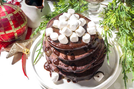 Christmas morning breakfast chocolate pancakes, hot chocolate pancakes with chocolate sauce and...