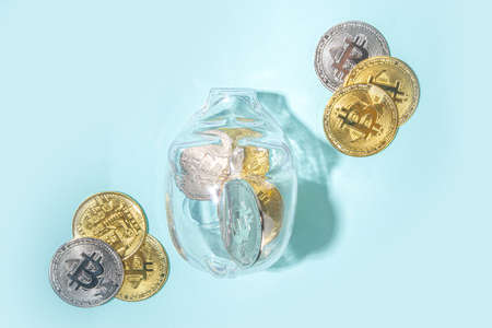 Bitcoin background, cryptocurrency virtual currency market concept. Gold silver bitcoin coins with...