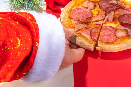 Christmas decorated background with pepperoni and mushrooms pizza, Delivery and restaurant Xmas...