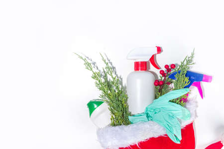 Christmas cleaning concept. Various bottles, equipment, and accessories, gloves for cleaning with...