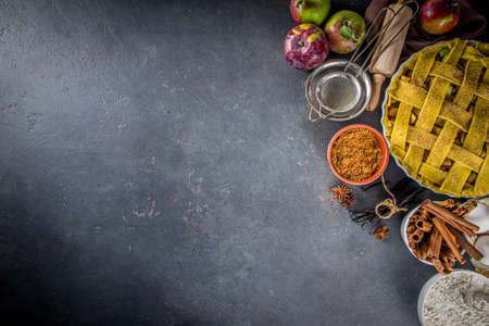 Autumn apple pie cooking background. Baking background with raw traditional classic apple pie,...
