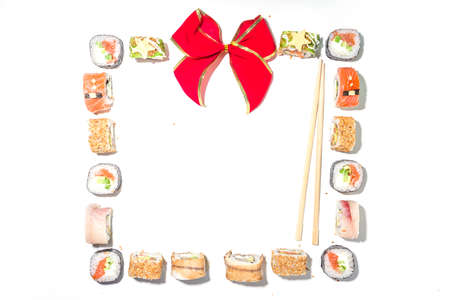 Christmas sushi set with funny decorated rolls like Xmas symbols - santa, deer, snowman, fir tree, Christmas sushi bar menu, festive delivery mock-upの写真素材
