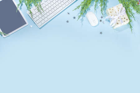 Simple minimal Christmas office background. Modern high-colored light blue background with office pc...