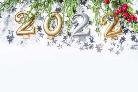 2022 new year greeting card background, festive banner with 2022 holiday candles, silver star decor,...