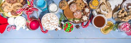 Christmas hot chocolate party bar, winter cocoa buffet with a lot of hot chocolate mugs, various topping, sprinkles, sweet appetizersの写真素材