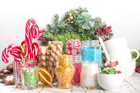 Christmas hot chocolate party bar, winter cocoa buffet with a lot of hot chocolate mugs, various topping, sprinkles, sweet appetizersの写真素材