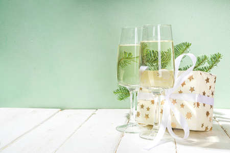 Two glasses with Champagne drink, simple festive Christmas and New Year backgroundの写真素材