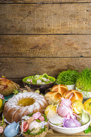 Festive dinner, Easter brunch. Traditional Easter dishes on family home table - baked meat, quiche,...