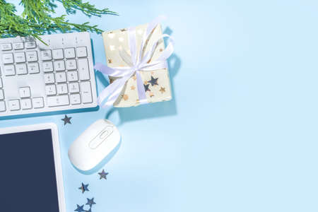 Simple minimal Christmas office background. Modern high-colored light blue background with office pc...