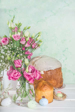 Happy easter greeting, invitation card background. Spring flowers composition with colorful easter...