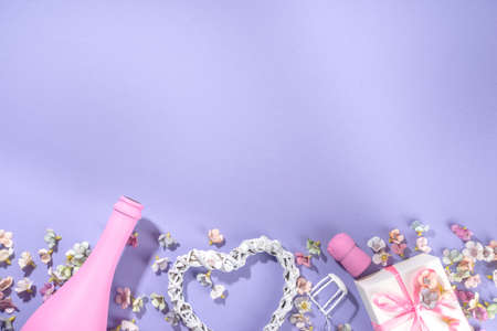 Cute high-colored Valentine day background, with pink colored champagne bottle, spring blossom...