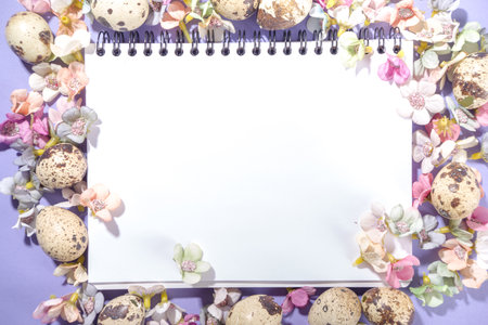 Spring Easter background, with small Easter eggs decoration, spring blossom flowers on violet very...