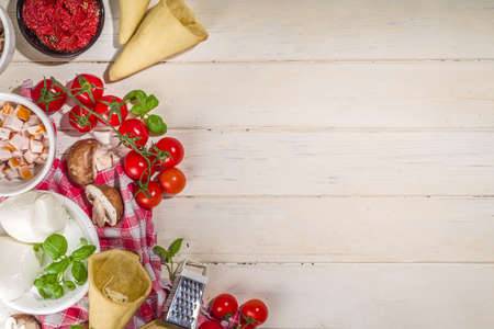 Cooking trendy Cone pizza background, modern pizza recipe, with tomatoes, basil, mozzarella cheese, baked pizza cones dough, ham and mushroomsの写真素材
