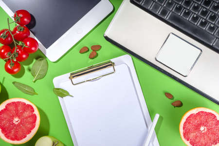 Meal diet plan concept, with in notepad, healthy food fruits, vegetables, tablet, notebooks and...