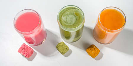 Modern Dissolvable Drinks concept, healthy homemade Dissolvable frozen dried smoothies with vegetables and fruits. Healthy organic snack on white background with frozen dried smoothie cubesの写真素材