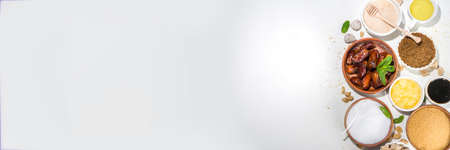 Various healthy diet replacement for sugar, natural organic sweetener concept, anti diabetes non-glycemic, sweetener. Various fruit sweet syrups, molasses, stevia, dates, coconut and date sugar, maple syrupの写真素材