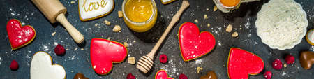 Valentine day sweet cooking background. Baking ingredients and utensils - flour, rolling pin, heart...