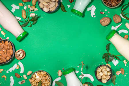 keto, paleo and vegan diet concept. Set of nut milks, bottles with various non-dairy nut milk -...