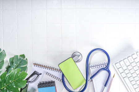 Doctor work table, diagnosis, electronic online treatment diagnostics. Female hands work on a laptop...