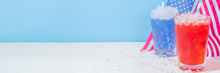 Drinks for American Independence Day celebration. USA flag colored red and blue iced cocktails copy spaceの写真素材